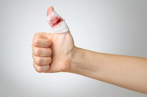 Injured finger with bloody bandage